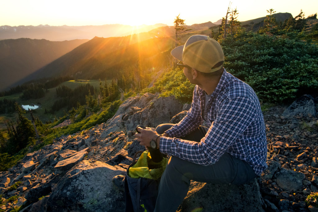 A man looks at the sunset on to of Hurricane Ridge in Olympic National Park