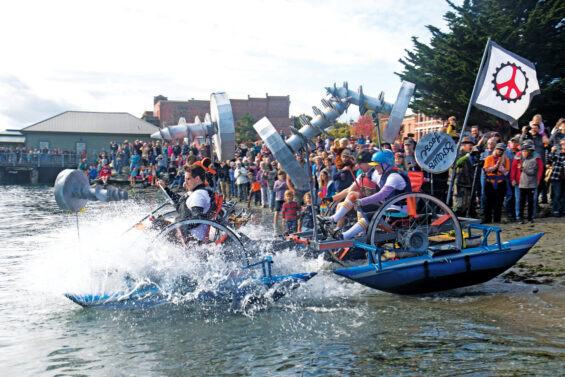 Photo of a kinetic sculpture entering the water during race in Port Townsend, WA on the Olympic Peninsula