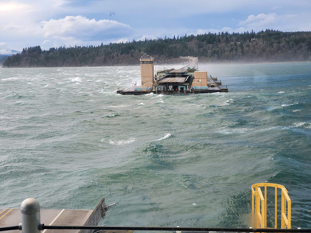 An image of the Hood Canal Bridge when it is opened during a windy day.