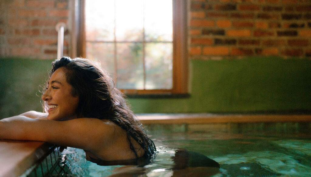 A woman soaks away with a day of wellness at Soak on the Sound in Port Townsend, WA on the Olympic Peninsula