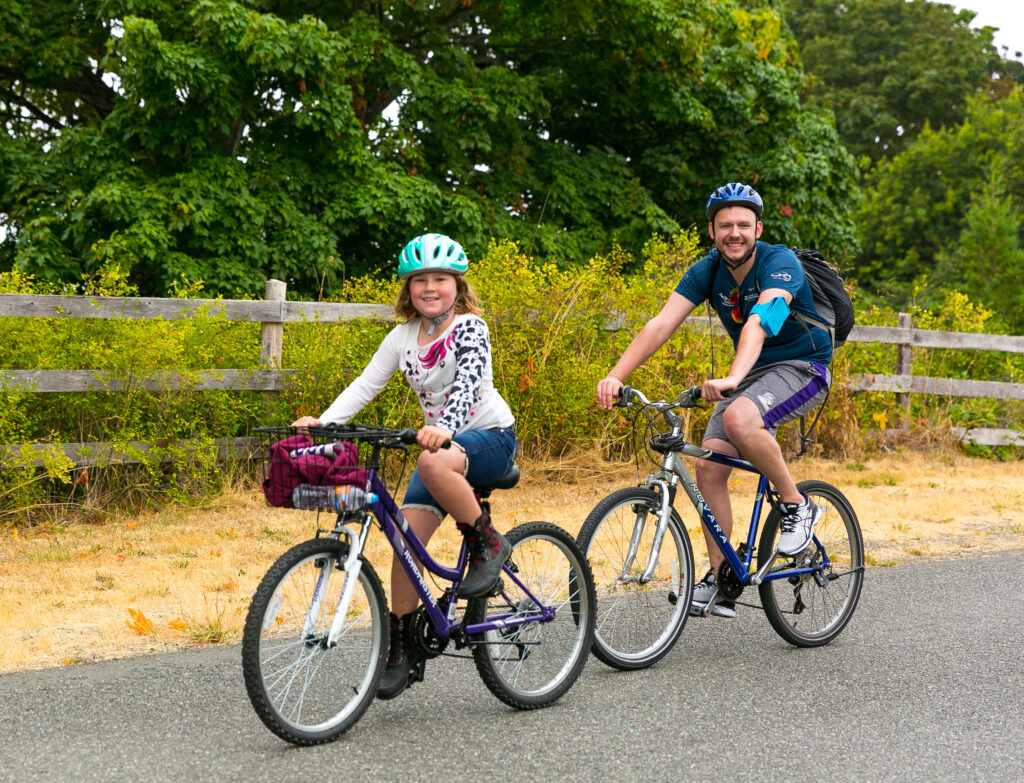 Father and daughter having bicycling adventures through the Sequim-Dungeness Valley