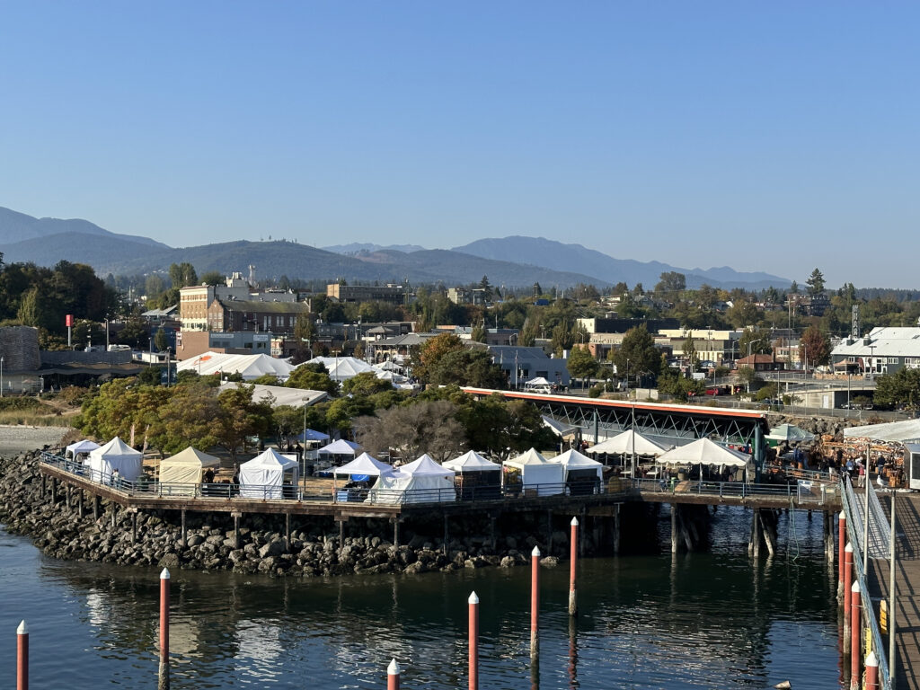 Photo of the Port Angeles pier from the water at the Dungeness Crab Festival: Tribal and Cultural Traditions