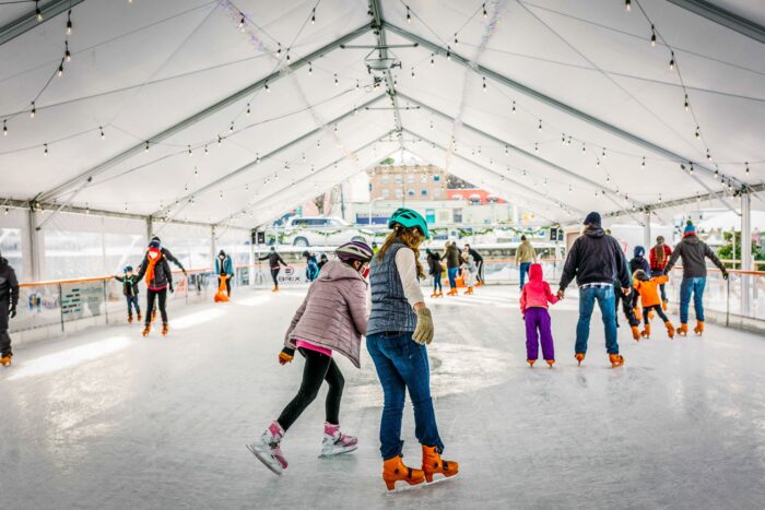 Photo of Port Angeles Winter Ice Skating Village with ice skaters skating