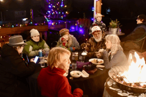 Photo of people in Holiday clothing enjoying the Hoodsport Yuletide Festival festivities