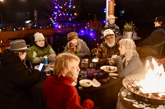 Photo of people in Holiday clothing enjoying the Hoodsport Yuletide Festival festivities