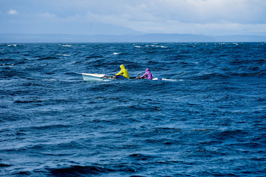 Photo of Race to Alaska race participants in a boat on the Queen Charlotte Strait