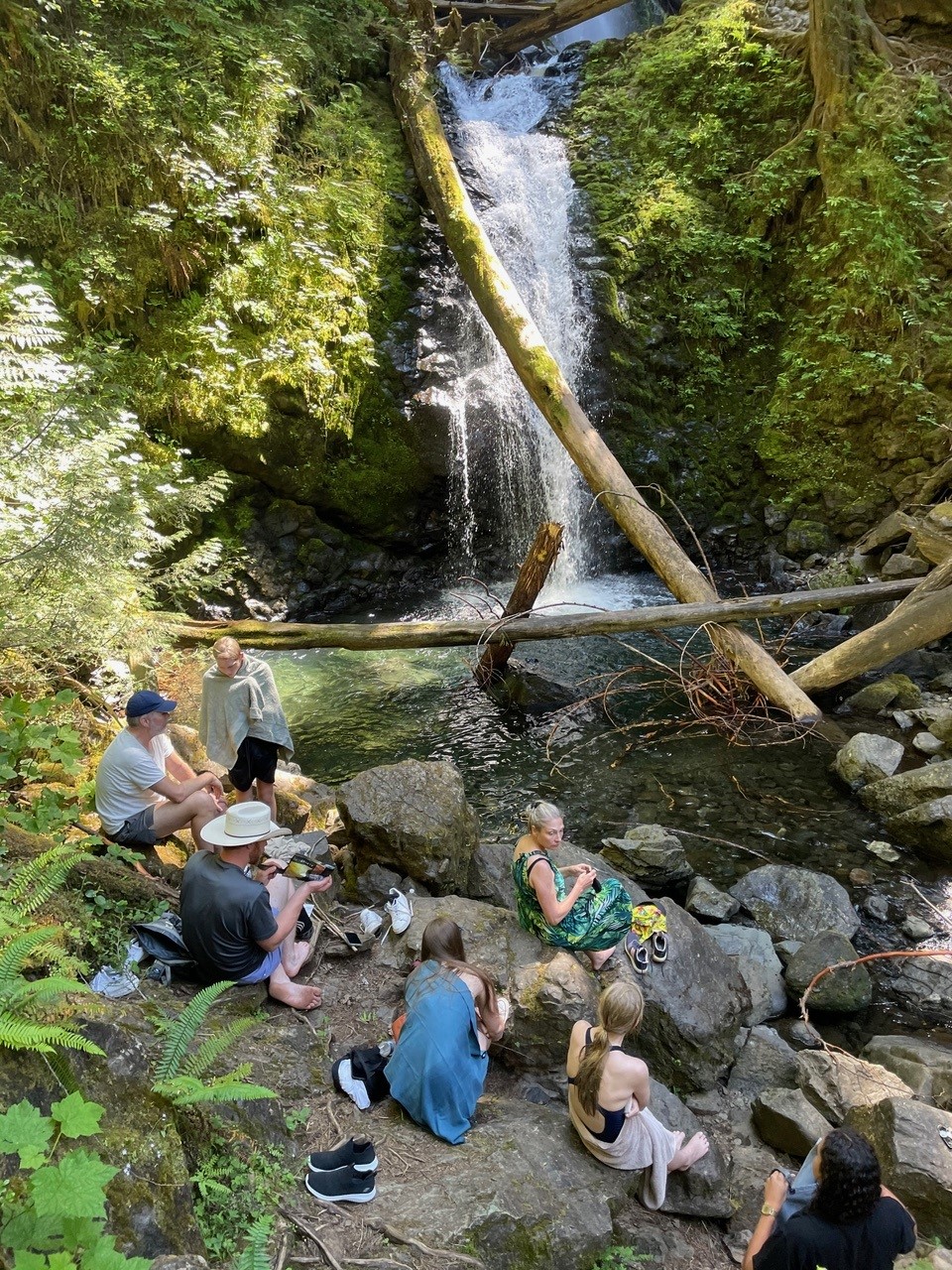 Photo that shows a picnic at people swimming at Murhut Falls on the Olympic Peninsula in Washington state