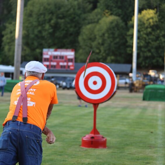 Photo of a person throwing an axe at a target at Hoquiam Loggers PlayDay
