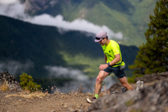 Photo of a person on a trail running in the Olympic National Forest during the Olympic Mountains Trail Races held near Quilcene, Washington