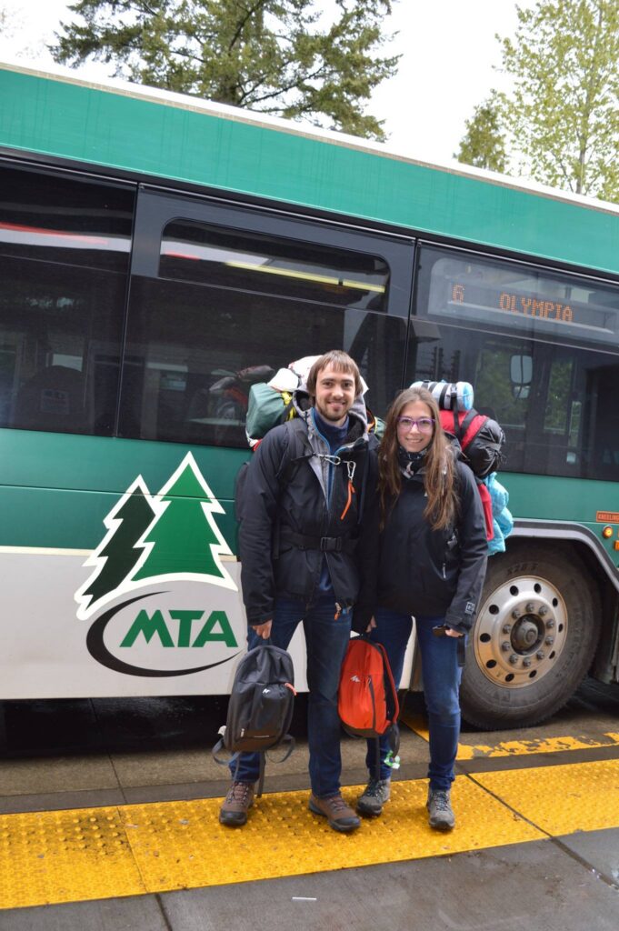 photo of a couple with backpacking gear about to get on a Mason Transit bus on the Olympic Peninsula