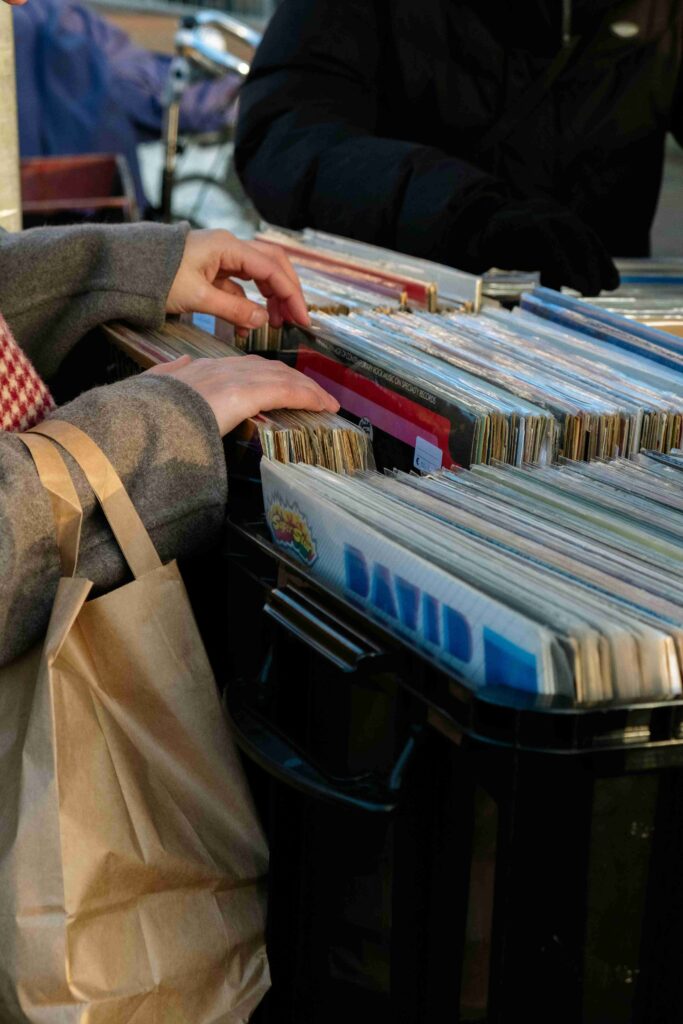 photo of someone perusing through a bin of vinyl records during the Sequim Annual Record Show