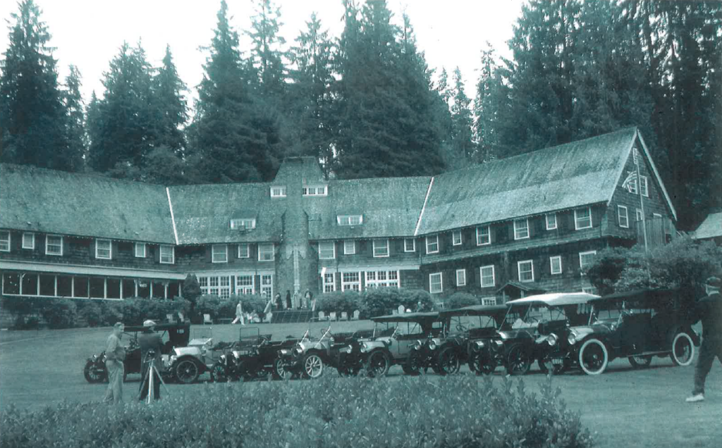 old black and white photo of Lake Quinault Lodge with old cars parked out front | Centennial Celebration at Lake Quinault Lodge